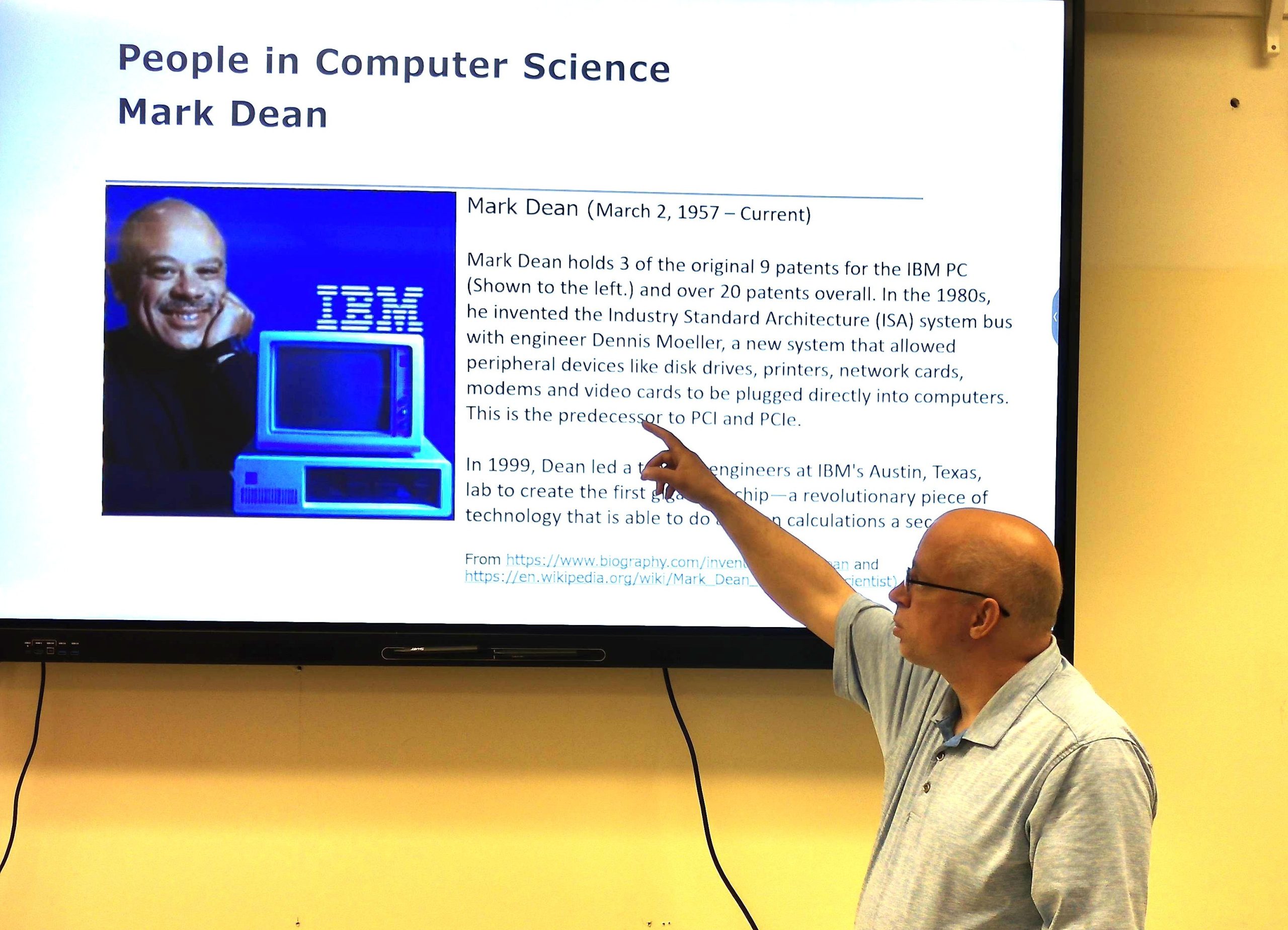 Image of me (Thomas Nelson) pointing at a power point of Mark Dean.